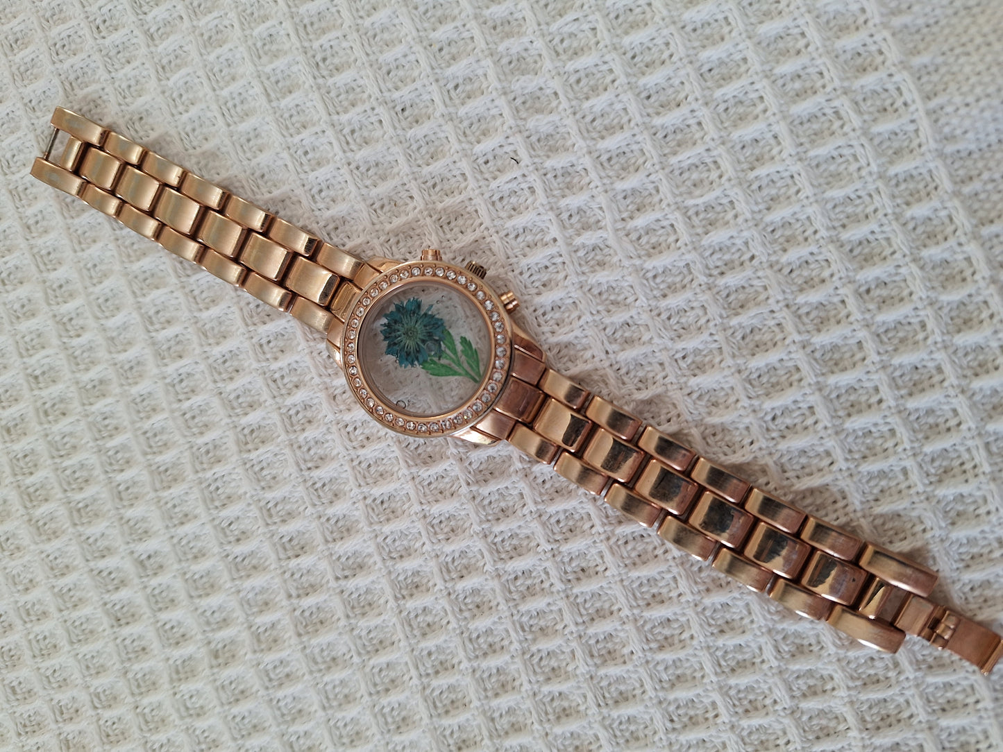 Watch Band Bracelet: Gold Tone with a Blue flower